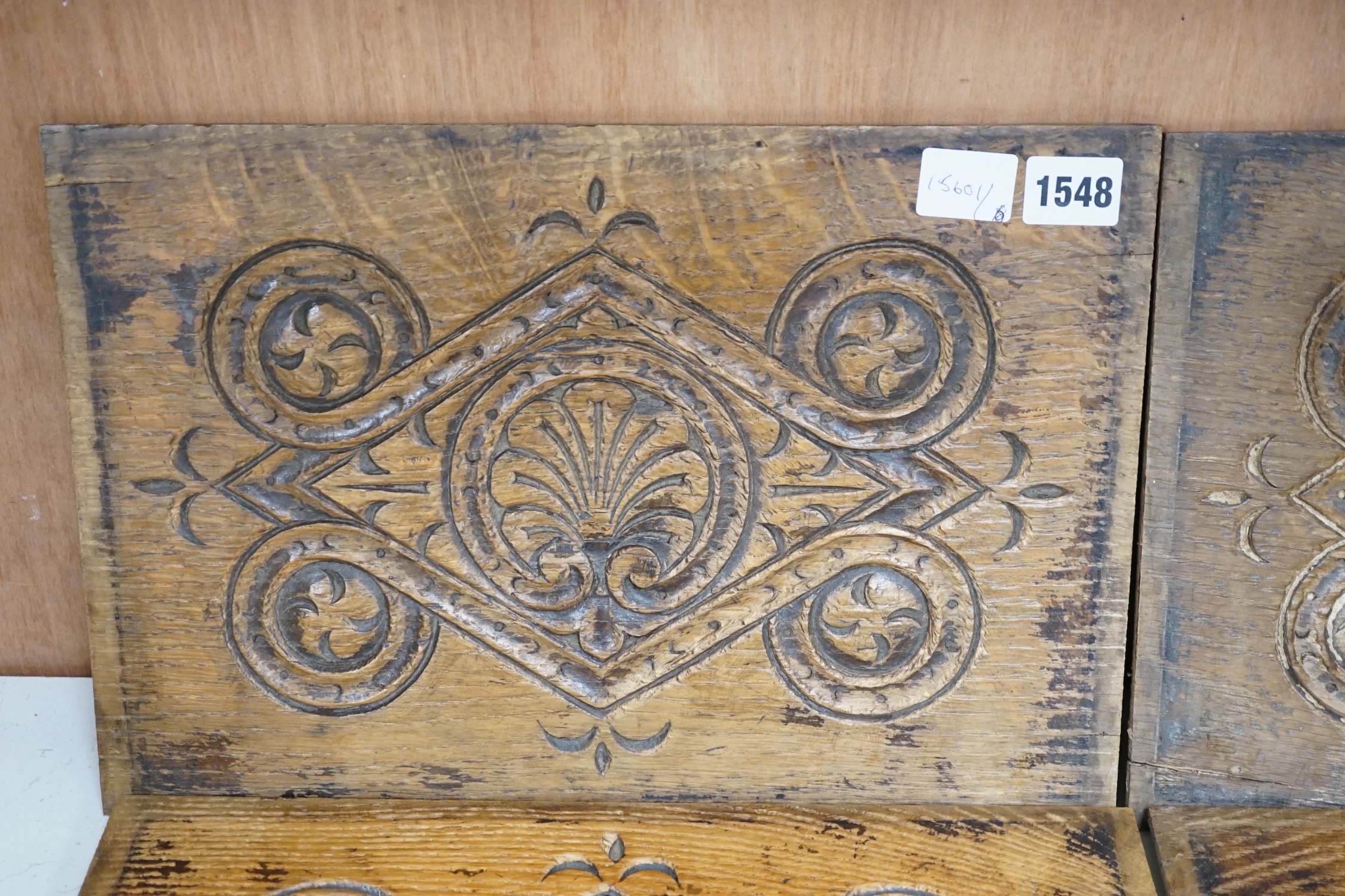 A set of four 18th century carved oak panels, 37cm x 25cm. Condition - two have splits